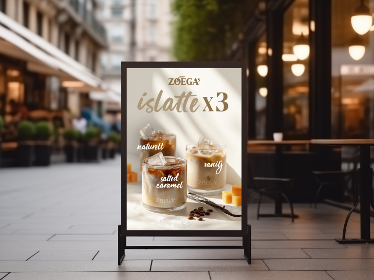 zoegas islatte skylt i trottoarpratare utanför cafe